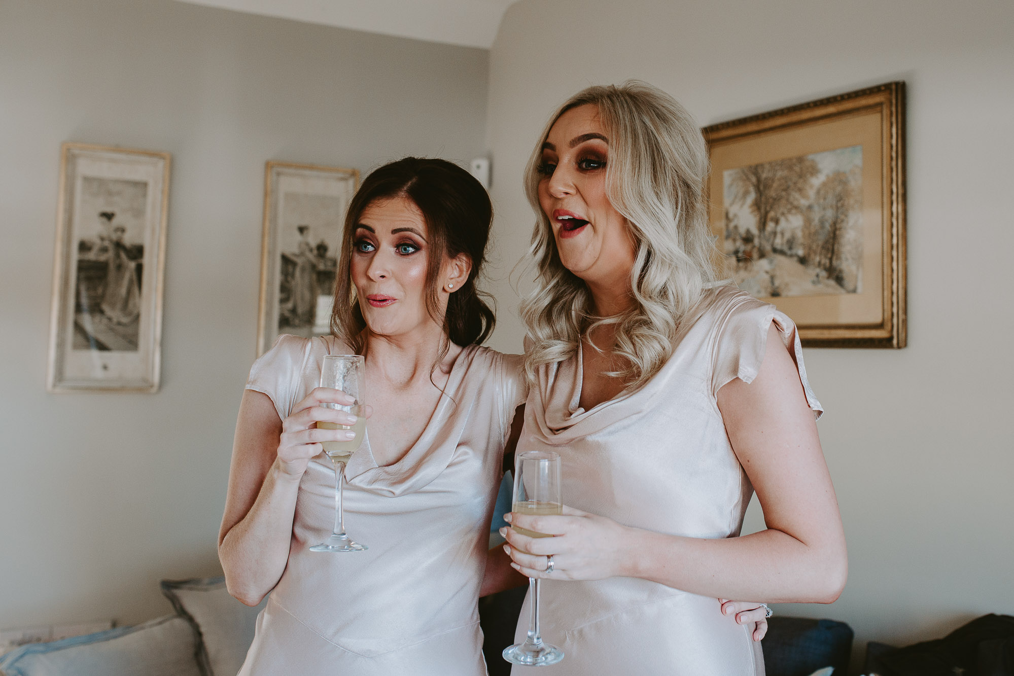 Bridesmaids react to seeing the bride
