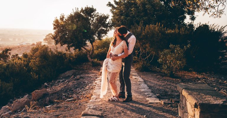 Bride and groom in ancient ruins in Cyprus